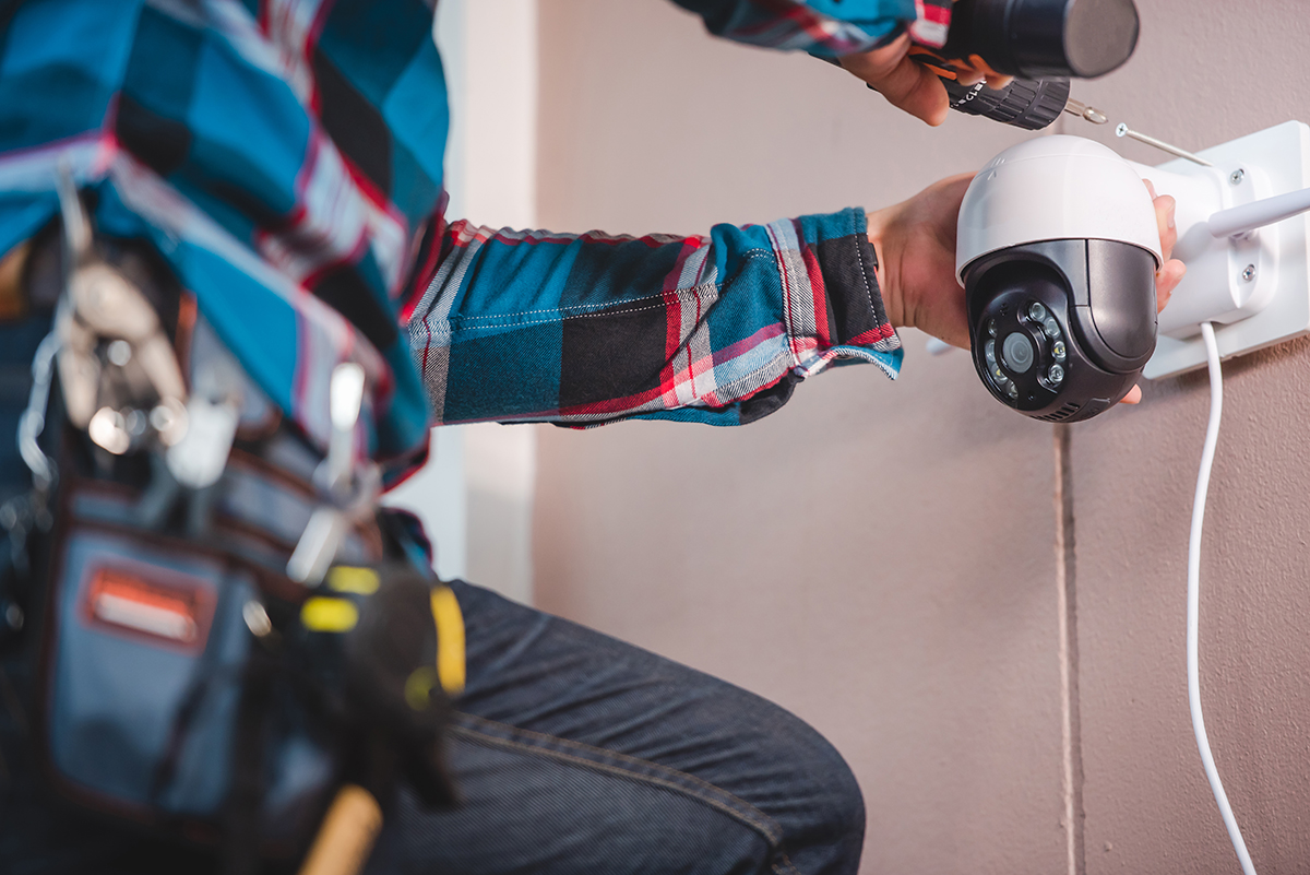 CCTV installation with young Asian technicians. Installation suc CCTV installation with young Asian technicians. Installation such as Wifi ip camera Concept: wireless IP camera